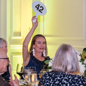 Erin Oveissi placing her bid